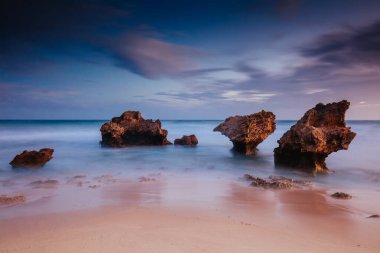 The lesser known Monforts Beach and Rabbit Rock with rockpool formations on a sunny day in Blairgowrie, Victoria, Australia