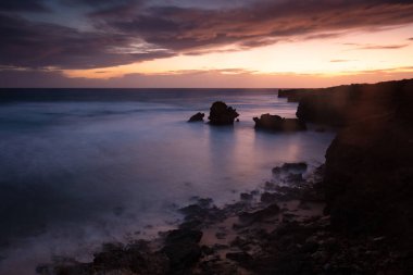 The lesser known Monforts Beach and Rabbit Rock with rockpool formations on a sunny day in Blairgowrie, Victoria, Australia