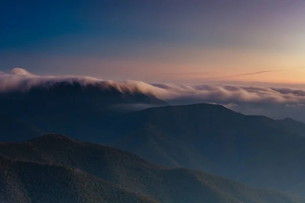 Landscape views of sunset from the summit of Mt Buller over the Victorian Alps in the Victorian High Country, Australia