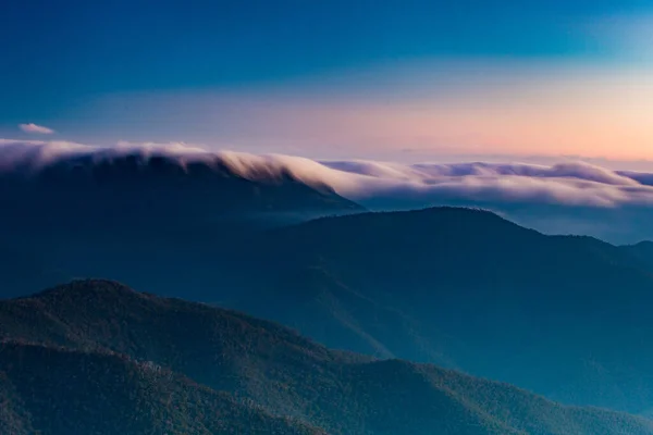 Landscape views of sunset from the summit of Mt Buller over the Victorian Alps in the Victorian High Country, Australia