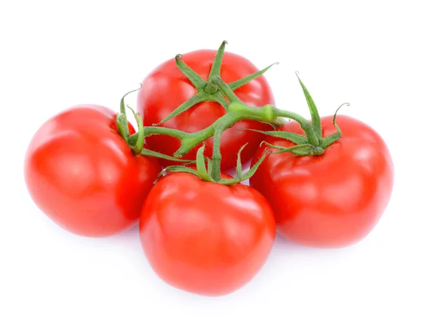 Beyaz arka planda yeşil yapraklı taze domatesler. — Stok fotoğraf