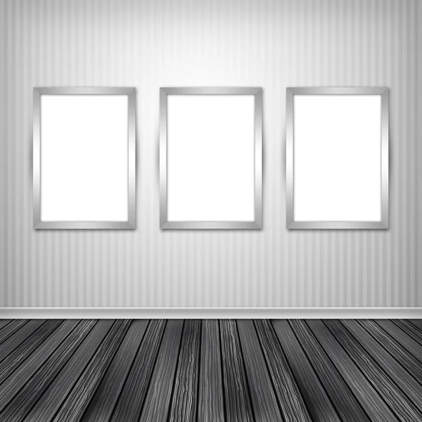 Drie lege frames op een muur — Stockfoto