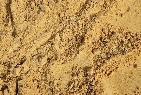 Primer plano de fondo de textura de pila de arena amarilla . — Foto de Stock