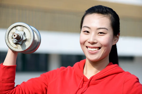 Fitness woman working out with dumbbell — Stock Photo, Image