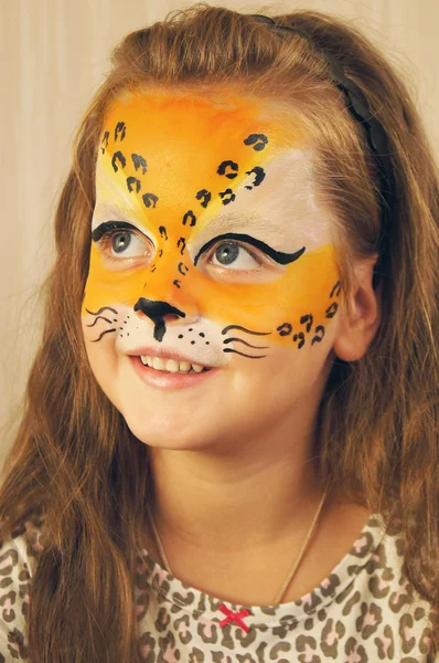 Girl with leopard face art