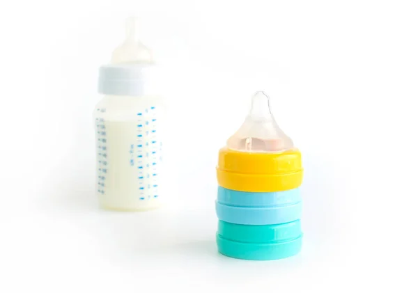 白い背景に哺乳瓶のためのペースメーカー — ストック写真