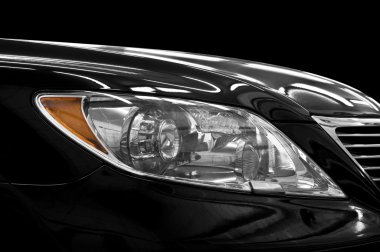 Closeup headlights of car. clipart