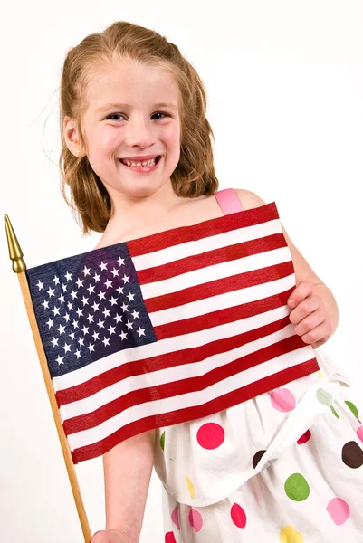 Jovem caucasiana segurando uma bandeira americana — Fotografia de Stock