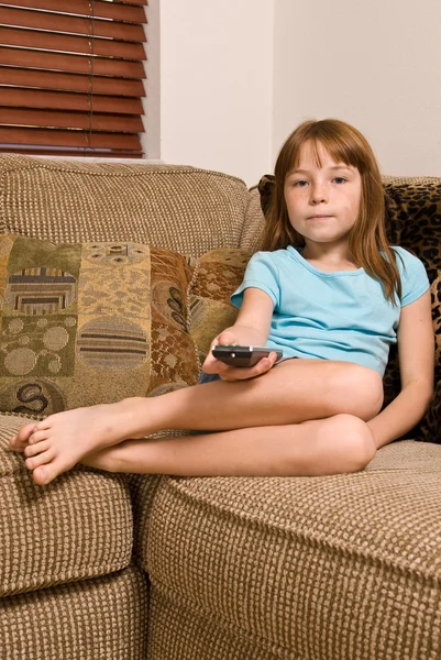 Young female child watching television — Stock Photo, Image