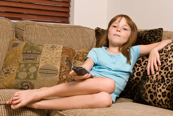 Young female child watching television — Stock Photo, Image