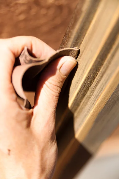 Hand of a woman sanding fixtures — Stock Photo, Image