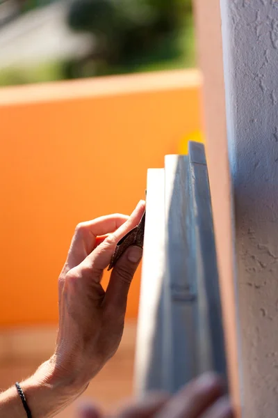 Hand of a woman sanding fixtures — Stock Photo, Image