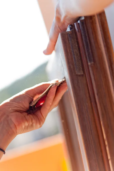 Hand of a woman sanding fixtures — Stock Photo, Image