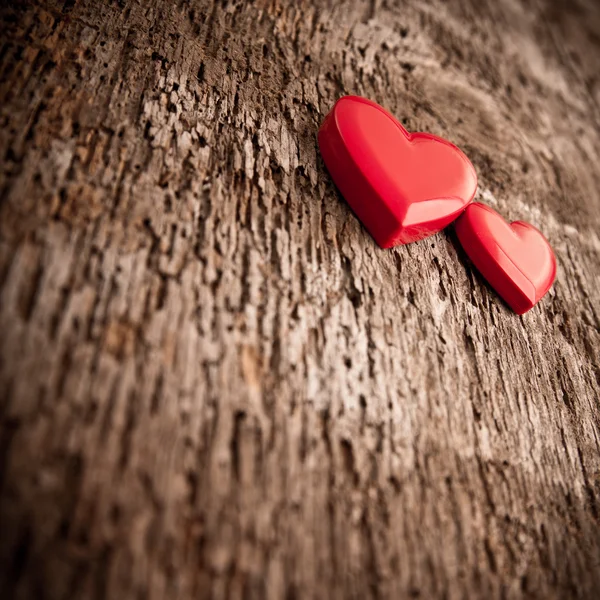 Love of red hearts on wooden background — Stock Photo, Image
