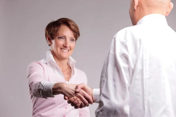 Successful senior woman handshaking — Stock Photo, Image
