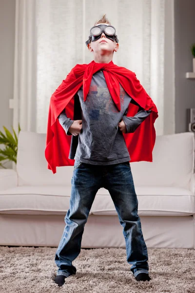 Red cloak  kid livingroom superhero — Stock Photo, Image