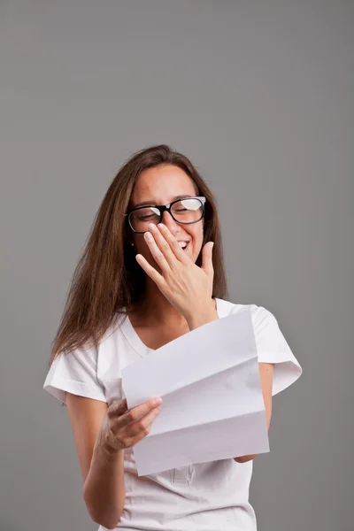 Girl touched by something she read — Stock Photo, Image