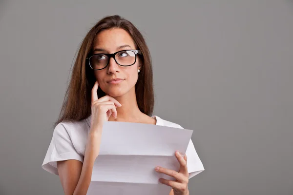 Girl thinking about news on a letter — Stock Photo, Image