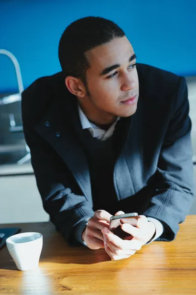 Stylish Young Businessman Looking Aside Deep Thought Leans Camera Wooden — Stock Photo, Image