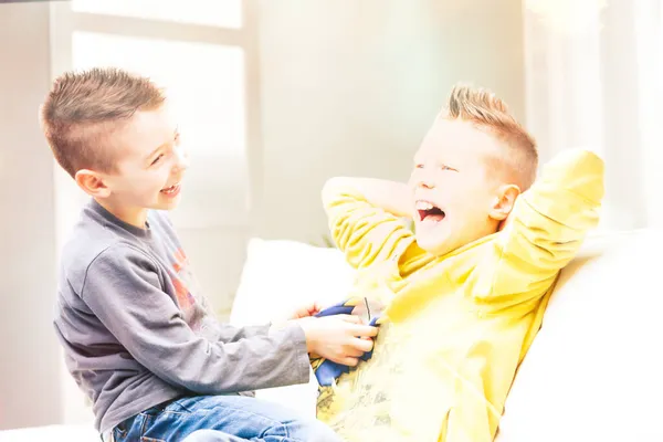 Two Laughing Young Brothers Tickling Each Other Sofa Relax Having — Stock Photo, Image