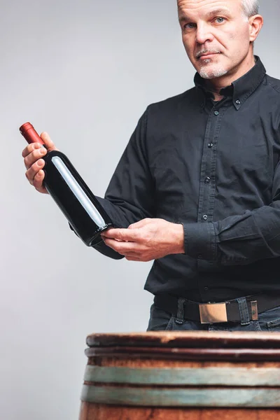 Senior Man Sommelier Standing Holding Bottle Red Wine Old Oak — Stock Photo, Image