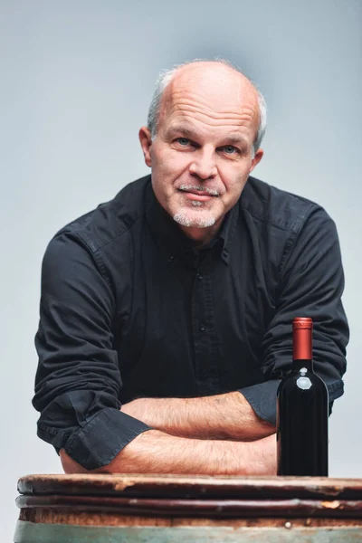 Senior Man Leaning Old Wooden Wine Barrel Unlabelled Bottle Red — Stock Photo, Image