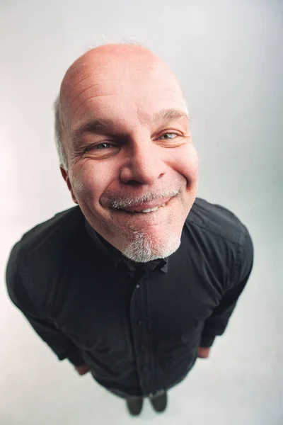 Top View Quirky Senior Man Biting His Lip Looks Camera — Stock Photo, Image