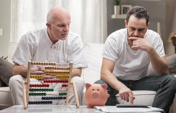 Two Generations Men Sitting Doing Financial Calculations Senior Man Using — Stock Photo, Image