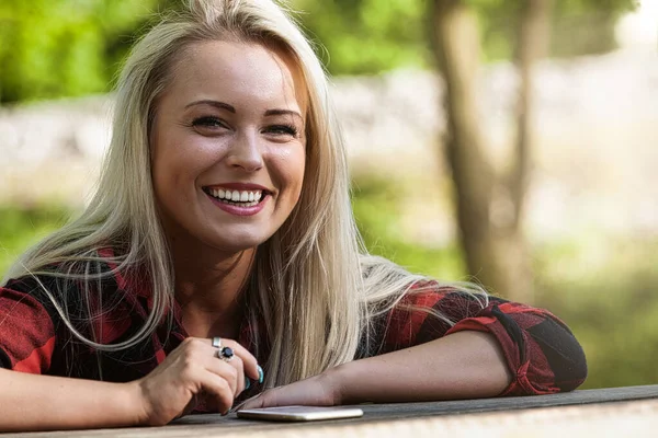 Smiling Happy Blond Woman Sitting Outdoor Table Park Garden Her — Zdjęcie stockowe