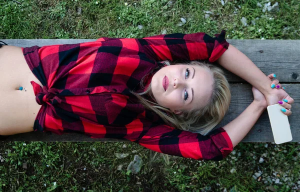 Trendy Young Woman Belly Piercings Lying Stretched Out Bench Green — Zdjęcie stockowe