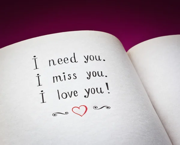 Hand drawn words I need you, I miss you, I love you in the open book with color background — Stock Photo, Image