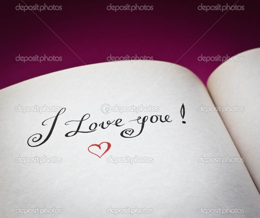 I love you words in the open book with pink background. Concept for declaration of love.Also good for postcard.