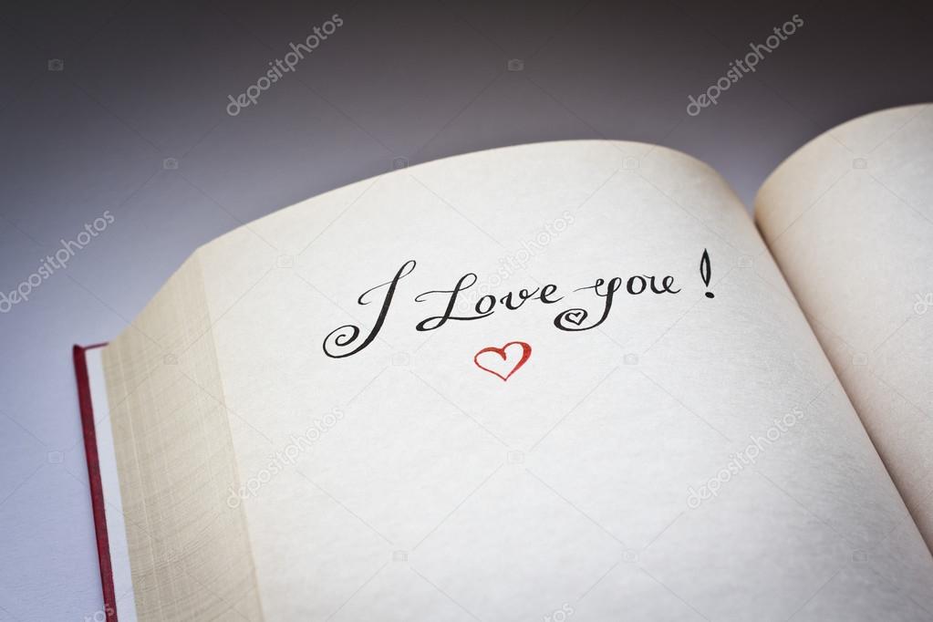 I love you words in the open book with grey background. Concept for declaration of love.Also good for postcard.