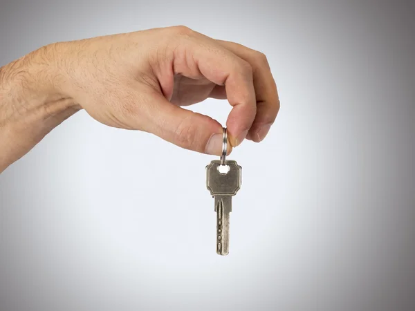 Hand with key — Stock Photo, Image