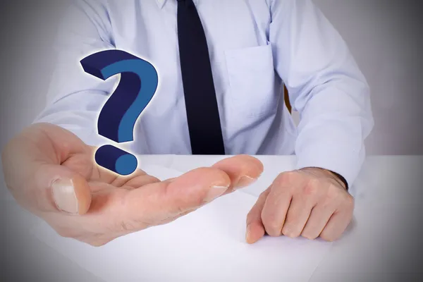 Businessman with question marks on hand — Stock Photo, Image