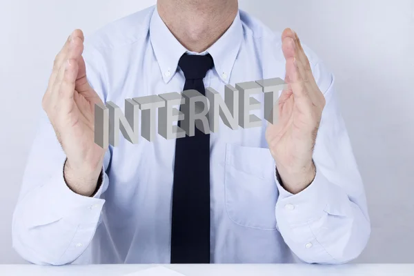 Businessman in office with computer terms — Stock Photo, Image