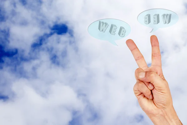 Hand in the clouds with words internet — Stock Photo, Image