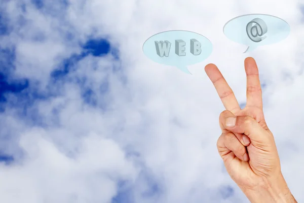 Hand in the clouds with words internet — Stock Photo, Image