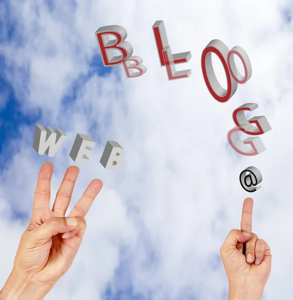 Hand in the clouds with words internet — Stock Photo, Image