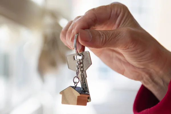 Mortgage Concept Hand Holding Key House Keychain Modern Light Lobby — Stock Photo, Image