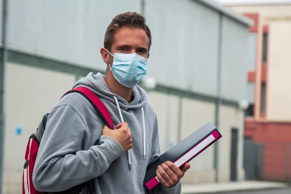 student with medical mask in the institute or university in the new normal