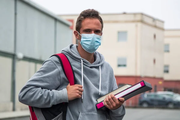 young student in high school with medical mask