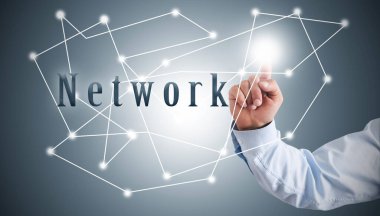 Businessman presses with finger on the structure of the network. network concept