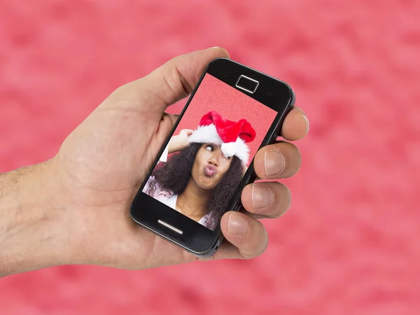 Hand Mit Handy Und Foto Von Weihnachtsmädchen — Stockfoto