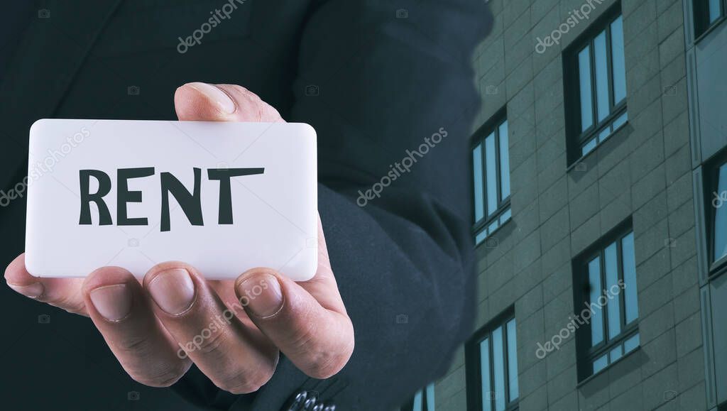 Businessman with real estate card. business concept