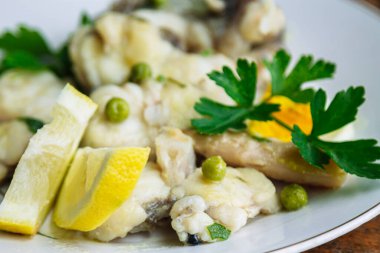 monkfish, fish stewed with parsley and lemon