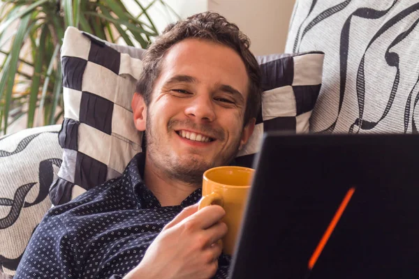 Happy Attractive Man Having Coffee Consulting His Laptop Home — Stock Fotó