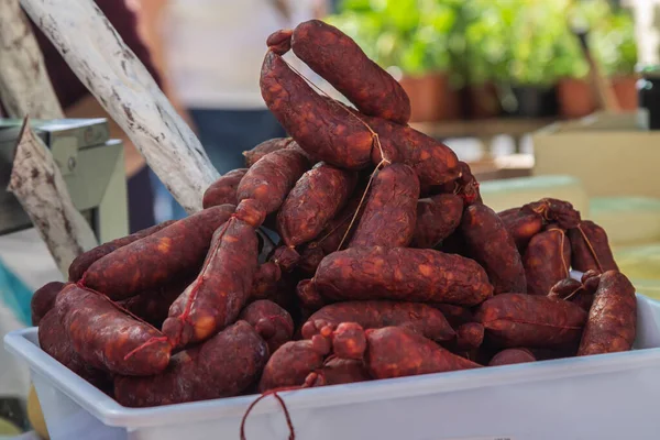 string of sausages in market stall