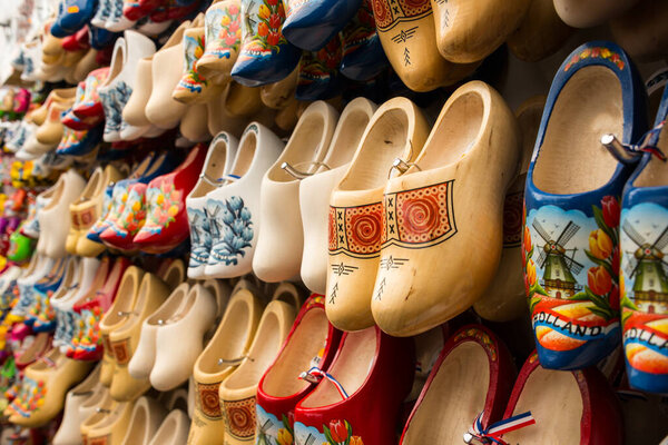 colorful authentic wooden Netherlands shoes selling on market