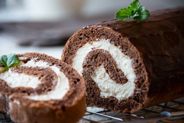 Sweet roll with wiped cream, delicious homemade chocolate cake clipart